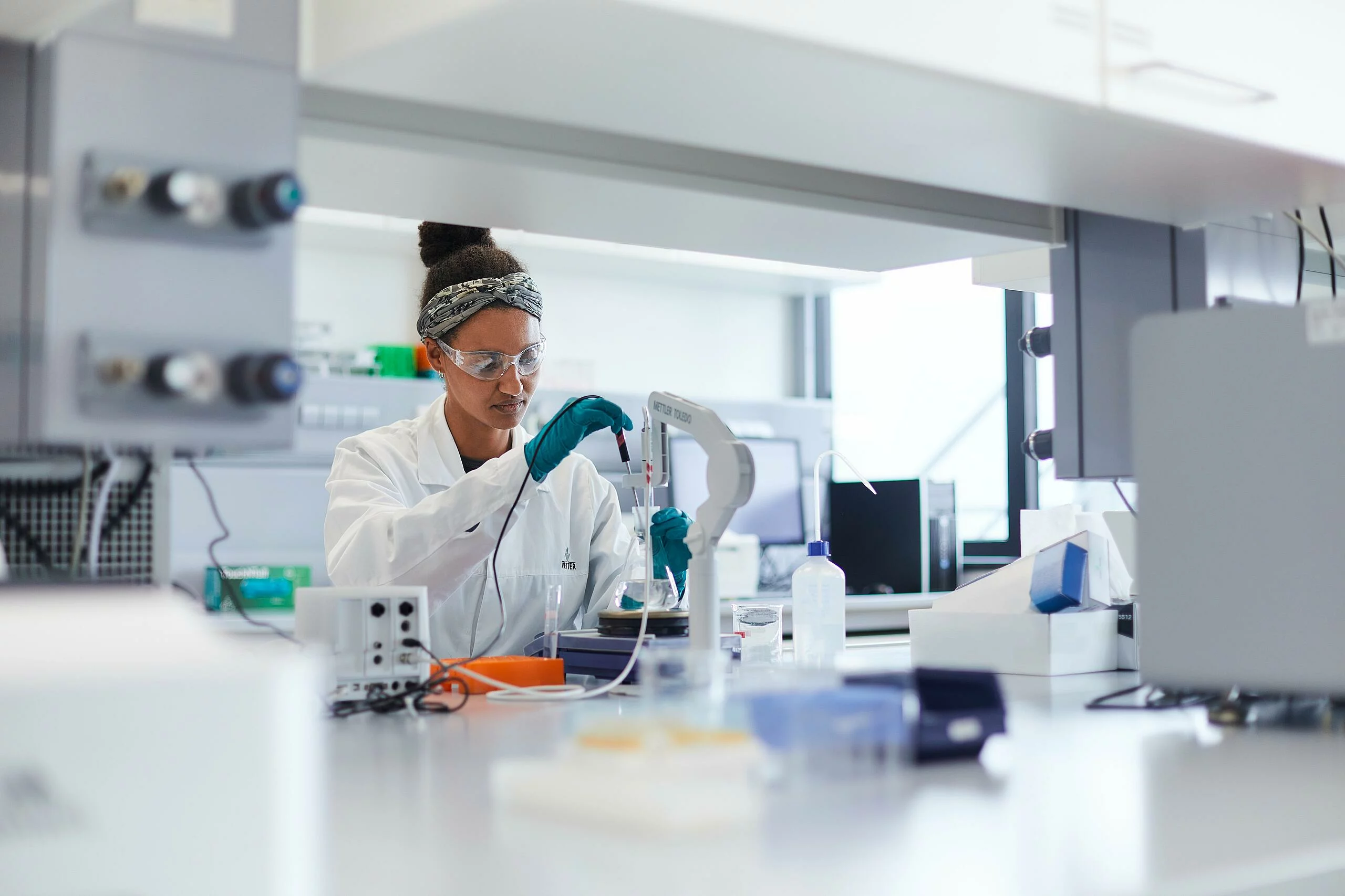 Lady performing a laboratory procedure